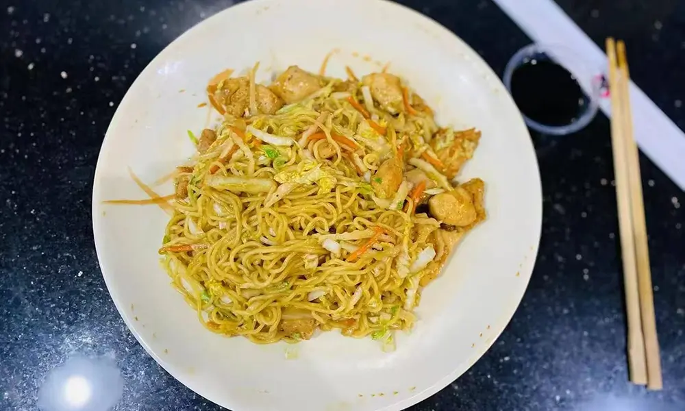 Chicken and vegetables stir-fried with noodles at A J House, a Asian Restaurant in Clarkesville