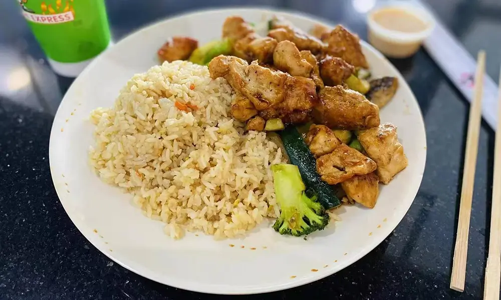 Chicken stir-fried with assorted vegetables and served with rice at A J House, a Asian Restaurant in Clarkesville
