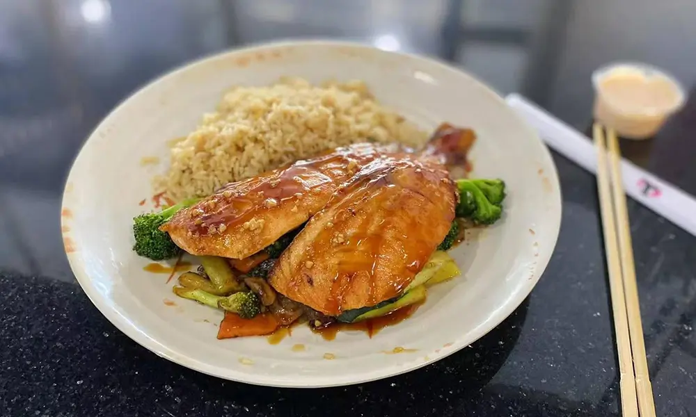 Teriyaki-glazed salmon served with rice and mixed vegetables at A J House, a Asian Restaurant in Clarkesville